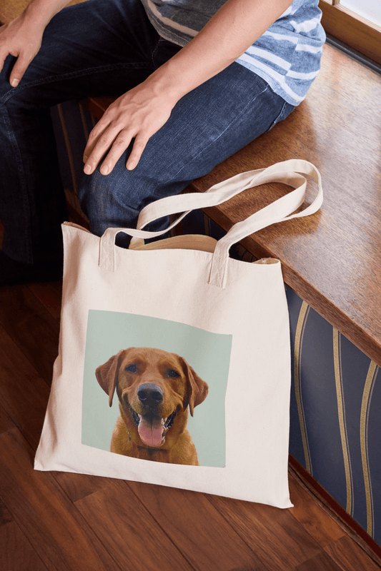 Image of the Classic Pet Portrait Tote Bag sat on the floor by a seat